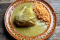 Mexican chicken with green mole sauce and red rice