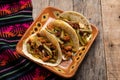 Mexican chorizo with nopal cactus tacos on wooden background