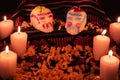 Mexican day of the dead altar with bread and sugar skulls on dark background Royalty Free Stock Photo