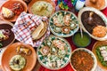 Traditional mexican dishes sopes, tacos dorados, tortillas, mole poblano, red rice, rajas poblanas, beans, pipian, salsa verde in Royalty Free Stock Photo