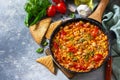 Chili con carne from meat, beans and vegetables on dark stone table. Copy space Royalty Free Stock Photo