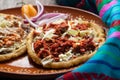 Mexican food: sopes of Chorizo and beef picadillo with cheese and beans Royalty Free Stock Photo