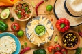 Traditional Mexican food on wooden table. Tortilla chips, guacamole, nachos, beans and salsa Royalty Free Stock Photo