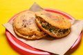 Mexican fried gorditas on yellow background
