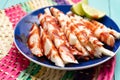 Mexican jicama cutted with chili powder and piquant sauce on turquoise background