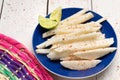 Mexican jicama cutted with chili powder on white background