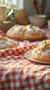Traditional mexican pan de muerto on checkered tablecloth near window Royalty Free Stock Photo