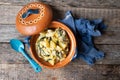 Mexican poblano rajas with potatoes and sour cream in clay cazuela Royalty Free Stock Photo