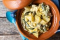 Mexican poblano rajas with potatoes and sour cream in clay cazuela Royalty Free Stock Photo