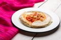 Mexican quesadilla with corn tortilla and piquant sauce also called sincronizada