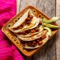 Mexican quesadillas with chorizo on wooden background Royalty Free Stock Photo