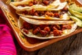Mexican quesadillas with chorizo on wooden background Royalty Free Stock Photo