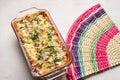 Mexican red baked enchiladas with melted cheese and sour cream on white background Royalty Free Stock Photo