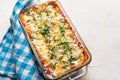 Mexican red baked enchiladas with melted cheese and sour cream on white background Royalty Free Stock Photo