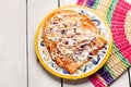 Mexican red enchiladas with melted cheese on white background Royalty Free Stock Photo