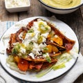 Mexican red enchiladas with potato and pork chorizo also called Potosinas on wooden background Royalty Free Stock Photo