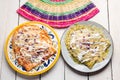 Mexican red and green enchiladas with melted cheese on white background Royalty Free Stock Photo