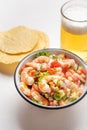 Mexican shrimp ceviche with tomato and serrano pepper on white background Royalty Free Stock Photo