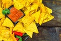 Nachos top view with Tortilla chips tomato salsa and mustard on rustic wooden background. A textured background.Copy paste place Royalty Free Stock Photo