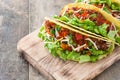 Traditional Mexican tacos with meat and vegetables on wood Royalty Free Stock Photo