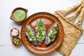Mexican tlacoyos with green sauce