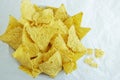 Traditional Mexican tortilla chips or nachos on white paper background Royalty Free Stock Photo