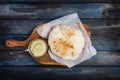 Traditional Middle east appetizer Hummus served with fresh pita bread. On a wooden board. Top view