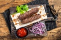 Traditional middle east kefta, kofta kebab from ground beef and lamb meat grilled on skewers served with flatbread and