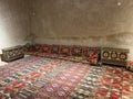 Traditional Middle Eastern floor seating (majlis) featuring vibrant red. Royalty Free Stock Photo