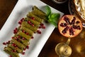 Traditional Middle Eastern food. Lebanese food. Arabian Stuffed Grape Leaves with Pomegranate seeds, top view