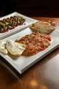 Traditional Middle Eastern food. Lebanese Stuffed Grape Leaves. Arabian cuisine. Aubergine with tomato, manakish