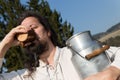 Traditional milk farmer drinking in the nature