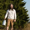 Traditional milk farmer in the nature Royalty Free Stock Photo