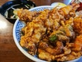 Traditional mixed prawn tempura in sesame oil on rice