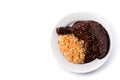 Traditional mole Poblano with rice in plate isolated on white background