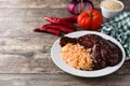 Traditional mole Poblano with rice in plate