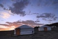 Traditional Mongolian Gers in a camp at sunset