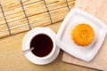 Traditional mooncakes on table setting with teacup Royalty Free Stock Photo