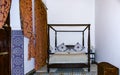 Traditional Moroccan bedroom with a canopy bed and mosaic in a r Royalty Free Stock Photo