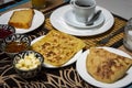 Traditional Moroccan breakfast with pancake, coffee, bread, butter, honey and jam