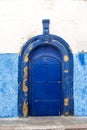 Traditional moroccan door with arch form painted blue