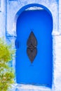 Traditional moroccan door in blue town Chefchaouen, Morocco. Vertical Royalty Free Stock Photo