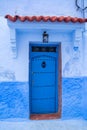 Traditional Moroccan door with canopy in Chefchaouen, the Blue Pearl Morocco Royalty Free Stock Photo