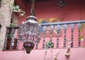 Traditional Moroccan glass copper lamp in oriental riad interior