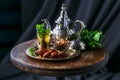 Traditional moroccan mint tea with copper teapot, dates and sugar Royalty Free Stock Photo