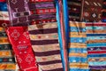 Traditional Moroccan carpets display at a market