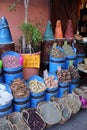 Traditional Moroccan shop - big blue containers with herbs, spice and small things in old city of Marrakech Royalty Free Stock Photo