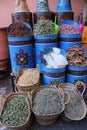 Traditional Moroccan shop - big blue containers with herbs, spice and small things in old city of Marrakech Royalty Free Stock Photo