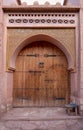 Traditional Moroccan style design of an ancient wooden entry door. In the old Medina in Ourzazate, Morocco. Typical, old Royalty Free Stock Photo