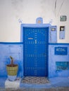 Traditional Moroccan style design of an ancient wooden entry door. In the old Medina. Royalty Free Stock Photo